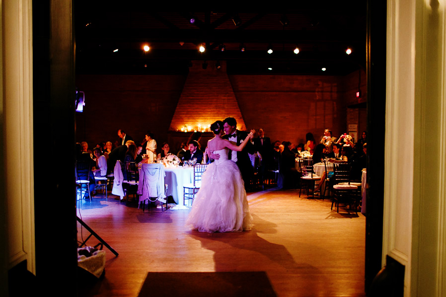 Bride and groom share a romantic first dance at a cozy Linden Place wedding reception.
