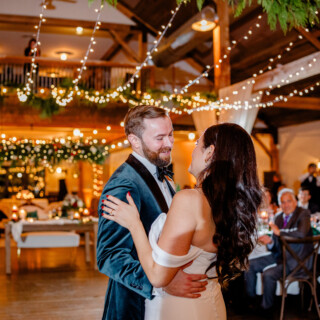 Bride and groom share romantic first dance under warm lights at Mountain Top Inn wedding.