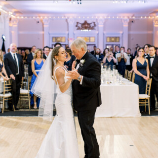 Bride shares emotional dance with her father at elegant Omni Mount Washington Resort wedding.
