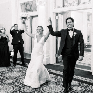 Bride and groom celebrate their wedding entrance at Omni Mount Washington Resort in Bretton Woods.