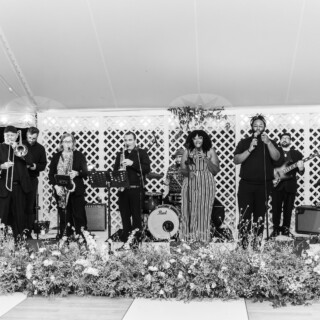 Live jazz band performing under tent at elegant Trapp Family Lodge wedding in Stowe, Vermont.