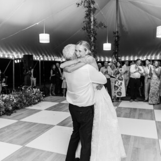 Father lifting smiling bride during emotional wedding dance at Trapp Family Lodge in Stowe Vermont.