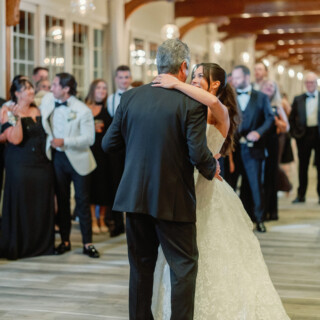Bride shares emotional father-daughter dance at elegant Wychmere Beach Club wedding in Harwich, Massachusetts.