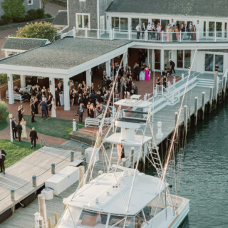 Elegant waterfront wedding reception at Wychmere Beach Club overlooking the marina in Harwich, Massachusetts.